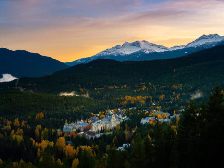 Fairmont Chateau Whistler at sunset with the mountain in the background